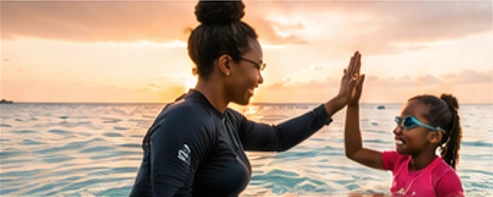 Illustrative instructor and swimmer sharing a high-five in the ocean